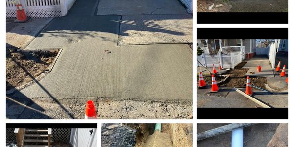 Freshly poured concrete sidewalk with safety cones around the work area.