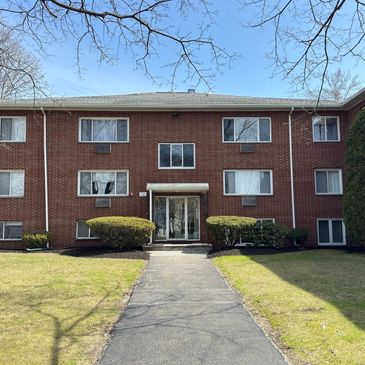 woburn condo green grass Anderson windows brick condo