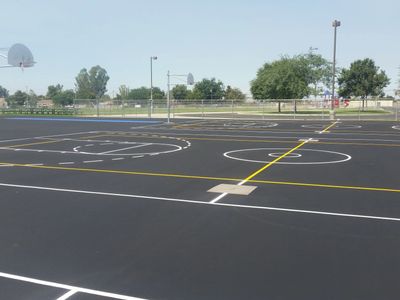 Seal Coating protects existing asphalt pavement from the elements and extends its life expectancy.