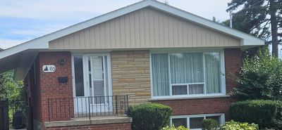 Residential home showing partial siding upgrade on select exterior sections