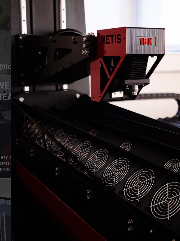 Close-up of a METIS 16K machine part with cooling fans.