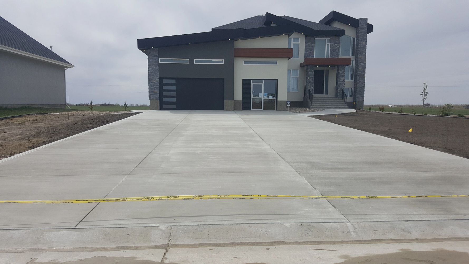 2019 Stars Lottery Showhome. This driveway & sidewalk is over 3000 sqft. We placed and finished it.