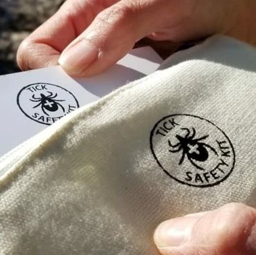 Inspecting the Tick Safety Kit in the secure canvas pouch