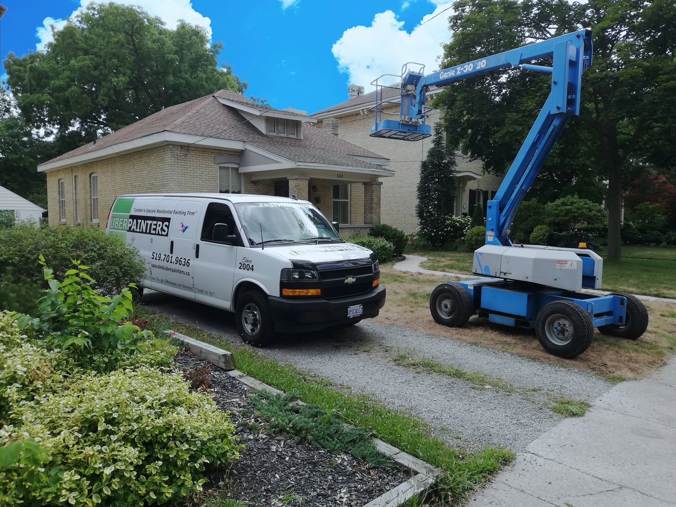 UBERPAINTERS van and genie crane in Woodfield Heritage District London, Ontario