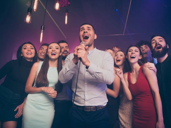 Low below angle view portrait of nice-looking attractive stylish trendy gorgeous event