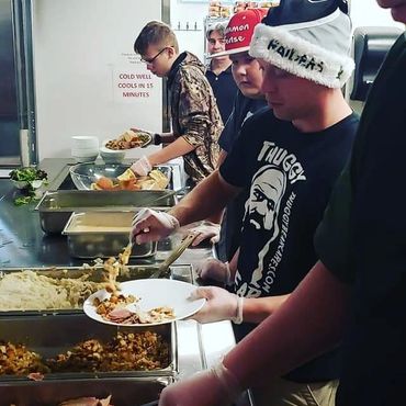 Thuggy Bear Cares volunteers at the Bethlehem Inn on Christmas morning.