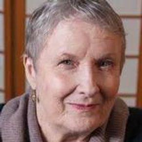 Front angle view of a lady smiling at the camera