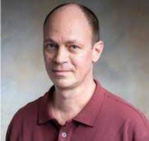 Close up shot of an old man smiling at the camera