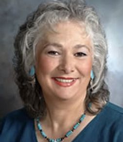 Close up shot of an old lady smiling at the camera