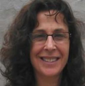 Front angle view of a lady smiling at the camera