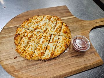 Pull-apart cheesy breadsticks made from pizza dough - Order now for hot Winnipeg pizza delivery.