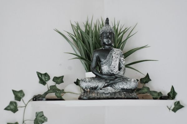 Buddha on shelf in Rebecca's therapy room