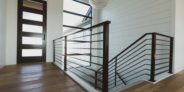 Entry and Stairs.  Powder-coated handrail and shiplap wall.