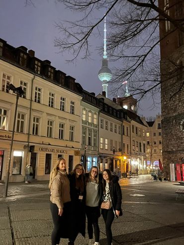 Students posing on a Berlin street with the TV Tower in the background