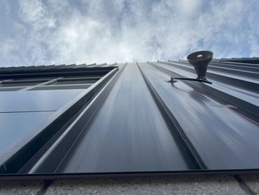 Our Standing Seam Roofing Panels utilized as a Siding Panel