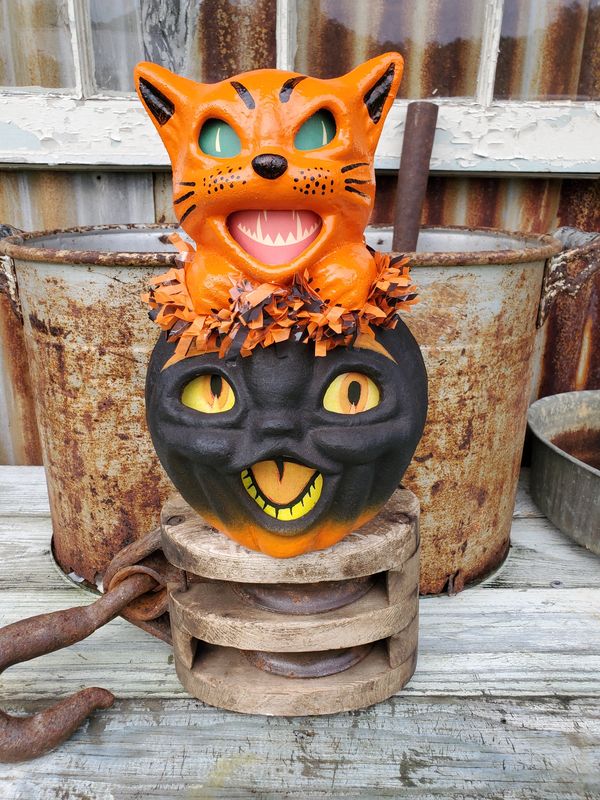 A vintage styled handmade papiermache pumpkin and cat is a perfect spooky decoration to add to your