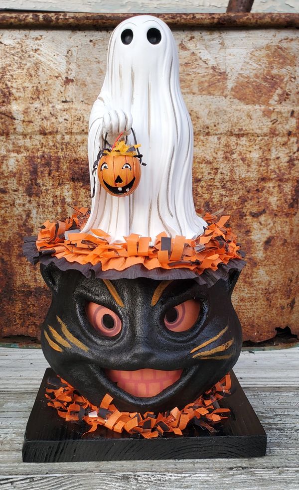 A fun and whimsical handmade autographed Halloween decoration made from papier mache and resin
