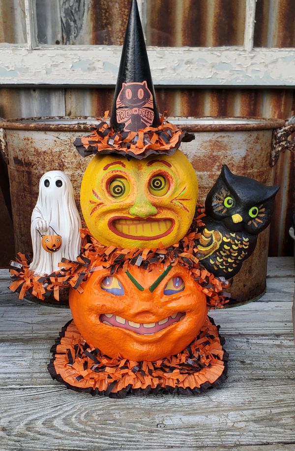 A fun and whimsical handmade autographed Halloween decoration made from papier mache and resin