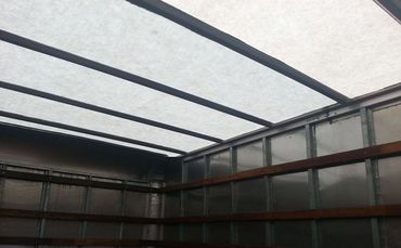 A High Ceiling of a Storage Room With Sunlight