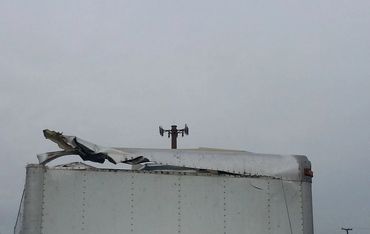 The Destroyed Back of a White Color Container