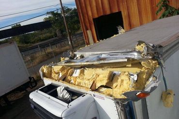 Foam Under a Steel Sheet of a Container in Front