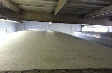 A New Roof Being Laid on a Truck in a Facility