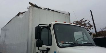 A Tattered Section of the Front of a Container
