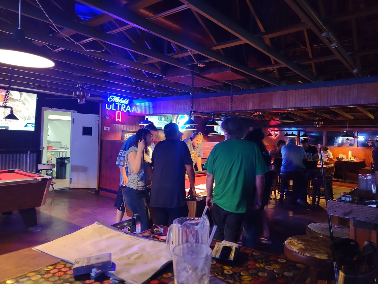 Brian running a 9 ball tournament. They are figuring out who won.