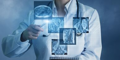 Physician reviewing several medical images about a patient