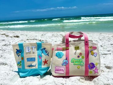 Custom made two colorful beach bags perfect for lazy beach days.