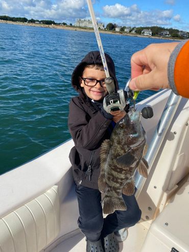 Child with his tautog