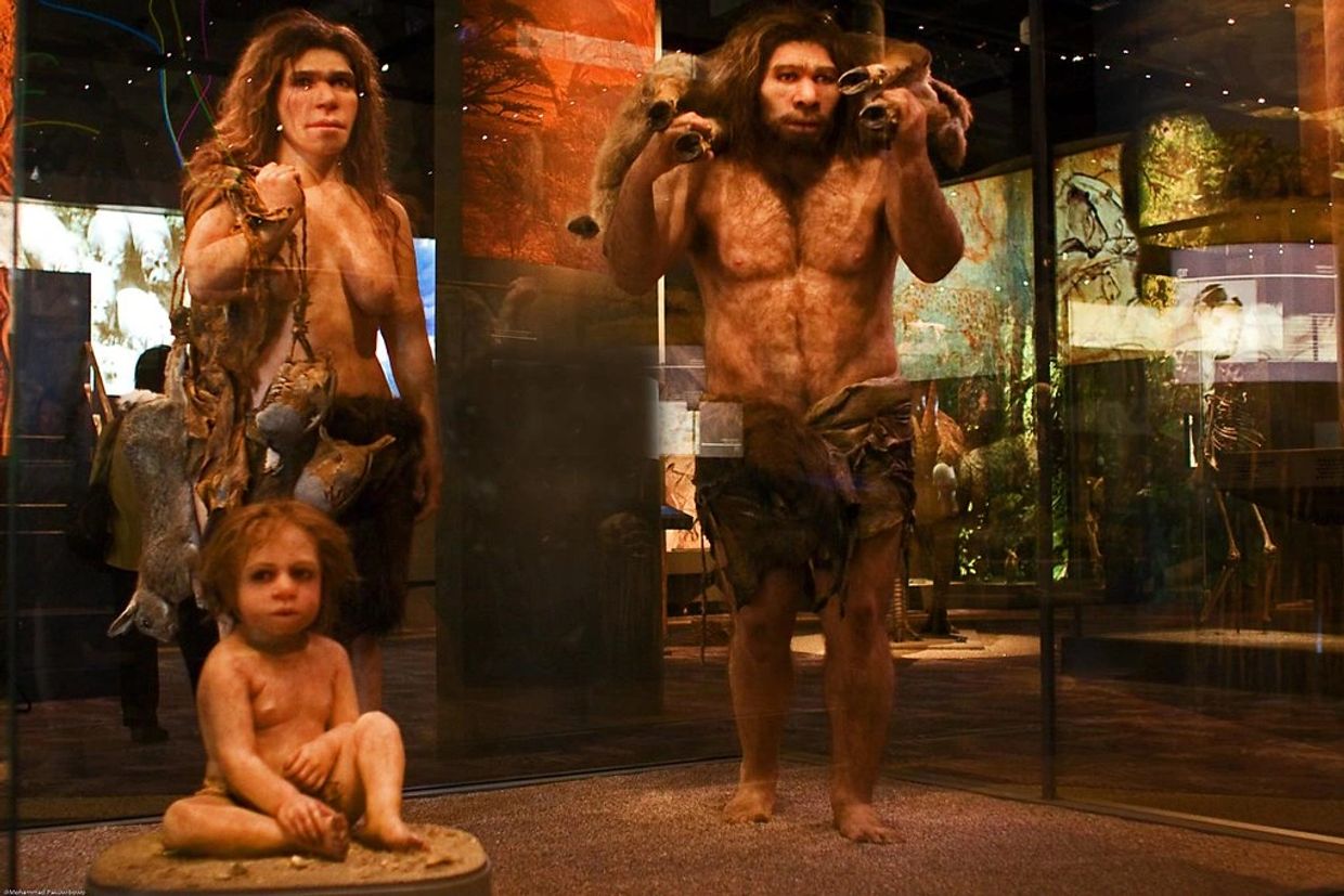 Photo of a pre-historic (350,000 years ago) man and woman and their young child
