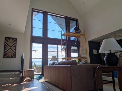LLumar Vista V38 window film being installed on a two-story window wall in a Harrisburg, SD home