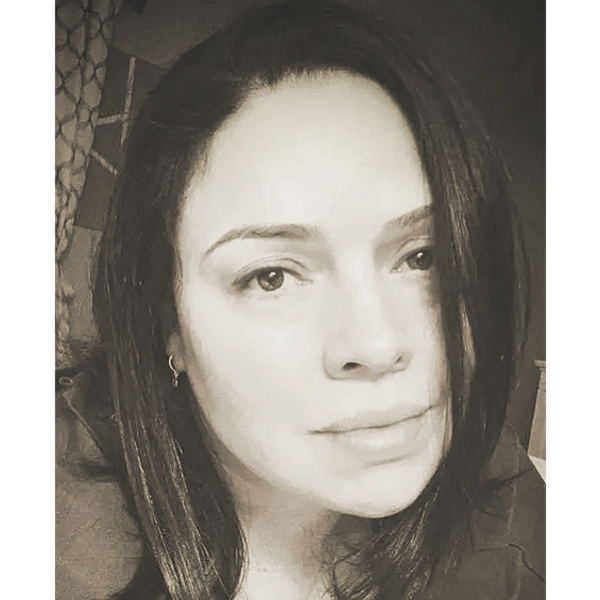 Close-up black and white portrait of a woman with dark hair.