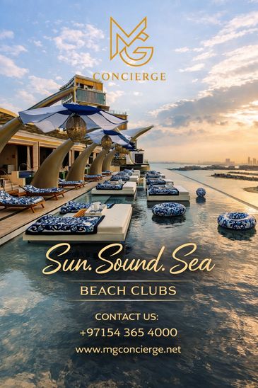 Luxurious beach club with sunbeds and umbrellas by the sea at sunset.