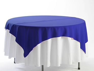 Round table with white and blue tablecloths.