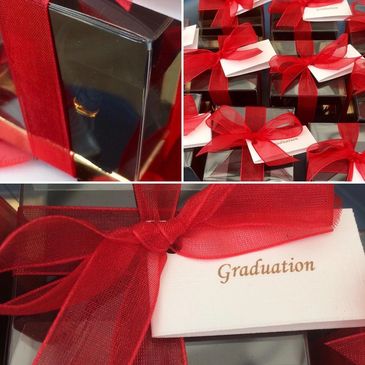 Bespoke Graduation bomboniera in a pvc box with red ribbon and bomboniere tag