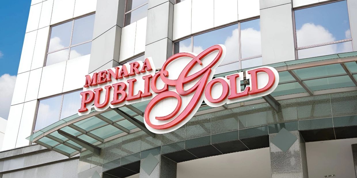 Signboard of Menara Public Gold on a building.