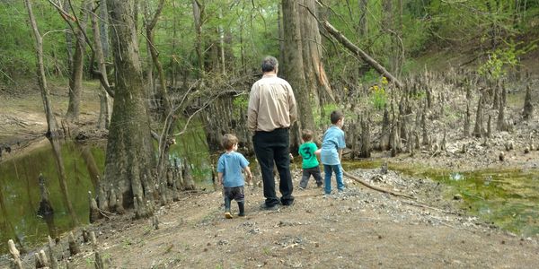 Grandfather, grandchildren, and cousins enjoy the legacy property that has been handed down.