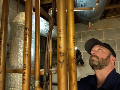 Inspecting boiler plumbing for maintenance