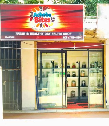Achebe Bites dry fruits shop with jars displayed inside.