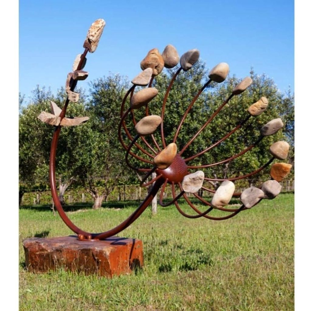Large sculpture made from metal and rock to look like a wishing stem