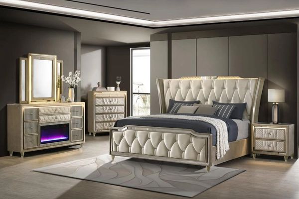 Elegant beige and gray bedroom set with tufted upholstery and modern lighting.