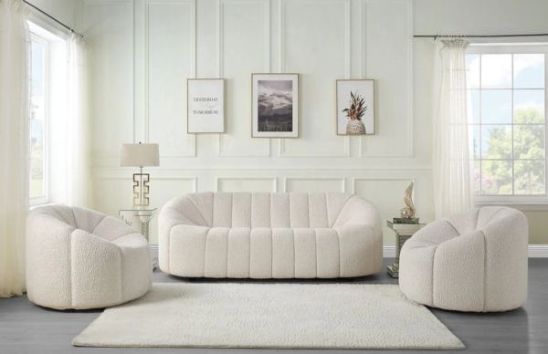 Modern living room with white furniture and soft lighting.