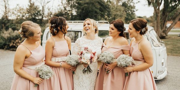 Bride Steph with our VW Campervan Dita at Shustoke Farm Barns courtesy of Katie Ingram Photography