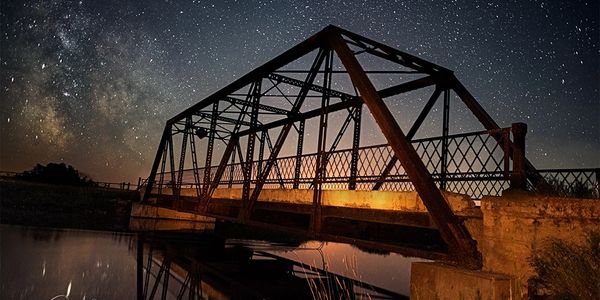 Nightscape of an abandoned Alberta bridge.
