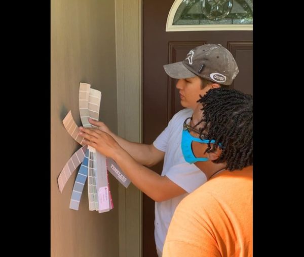 Dalton Vass, owner of Vassett Painting conducting a free color consultation with a client.