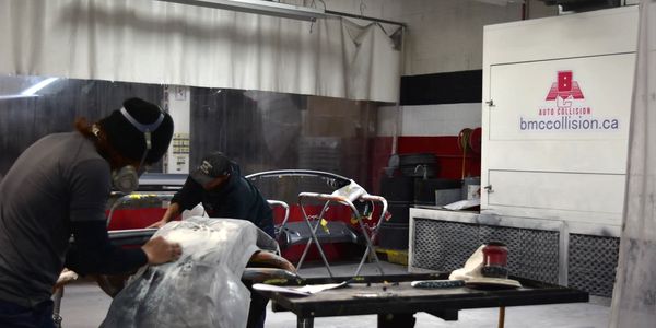 Auto repair technicians working at BMC Auto Collision Inc.