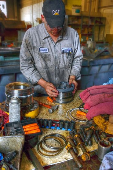 Caterpillar equipment Mechanic busy at-work.