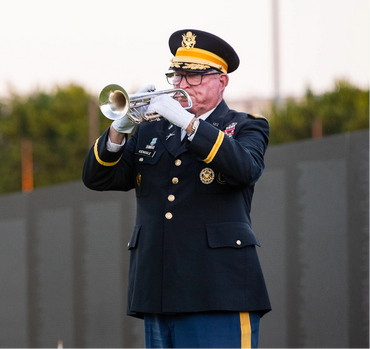 Ceremonial trumpet player playing TAPS during a Southern California funeral.